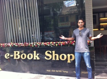 {The writer} {before} an "e-book shop" while {on holiday}