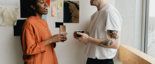 two people talking at work