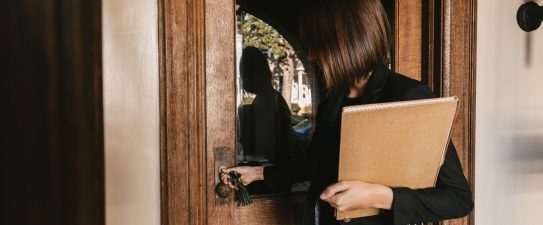 woman opening a door