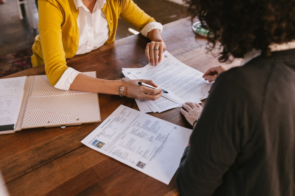 women reviewing paperwork