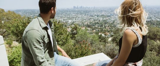 couple looking out over a city view