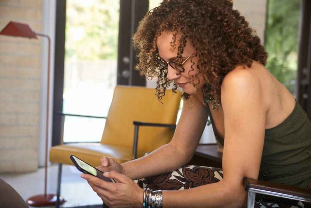 woman looking at cell phone