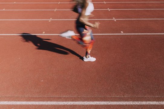 woman running on a track