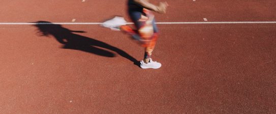 person running on a track