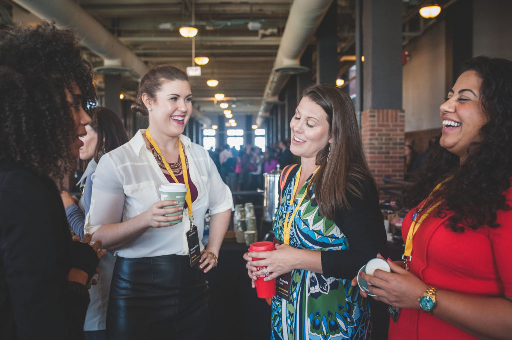 Women talking at conference