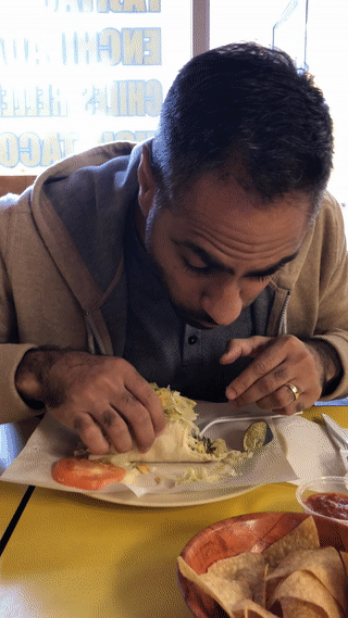 Ramit eating tacos