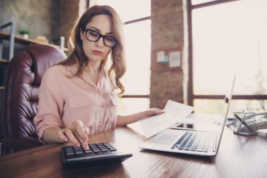 Woman using a calculator