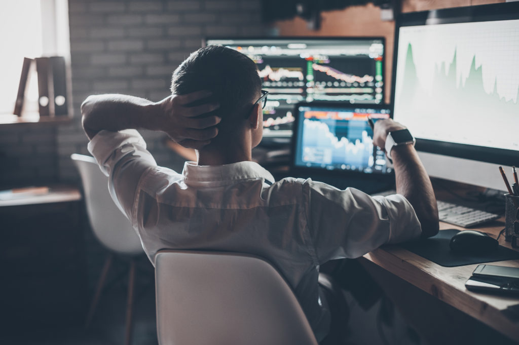 person looking at stocks on a computer